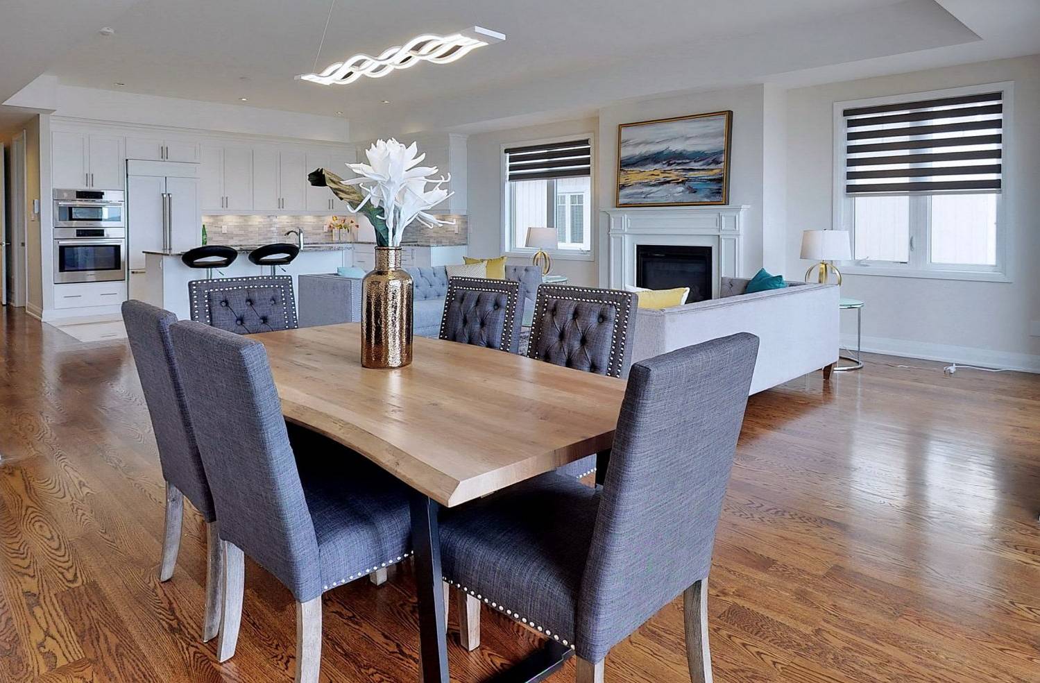 Dining room with wood dinner table with by StyleBite condo and home staging services in Toronto