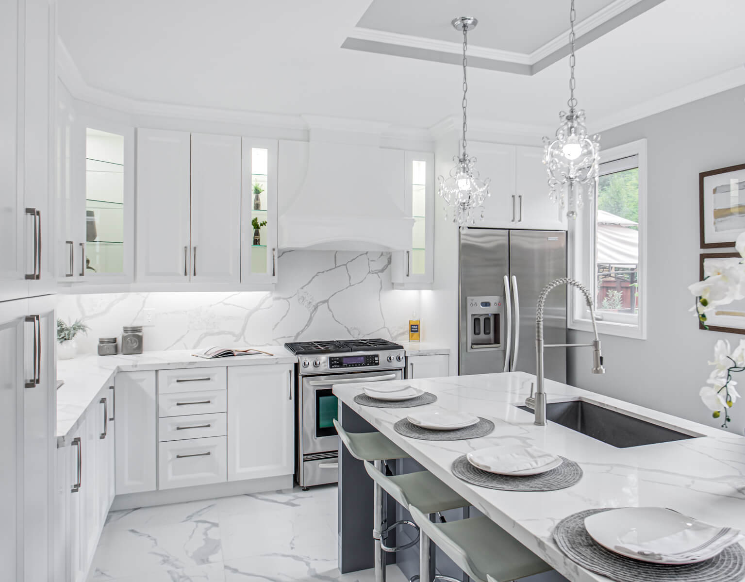 All white kitchen staged with silver decor by StyleBite condo and home staging services in Toronto