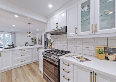 White and gold kitchen staged by StyleBite home staging services in Toronto