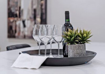 Dinner table staged with crystal glass and plants by StyleBite home staging services in Toronto