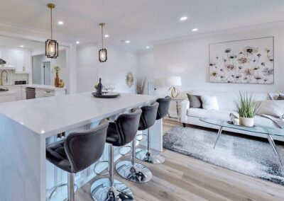 Breakfast island staged with grey chairs and crystal decor by StyleBite home staging services in Toronto.