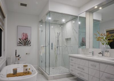 All-white bathroom staged with white decor and flowers by StyleBite home staging services in Toronto.