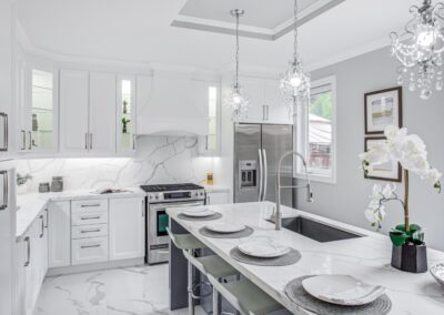 All white marble kitchen staged with silver decorations by StyleBite home staging services in Toronto.