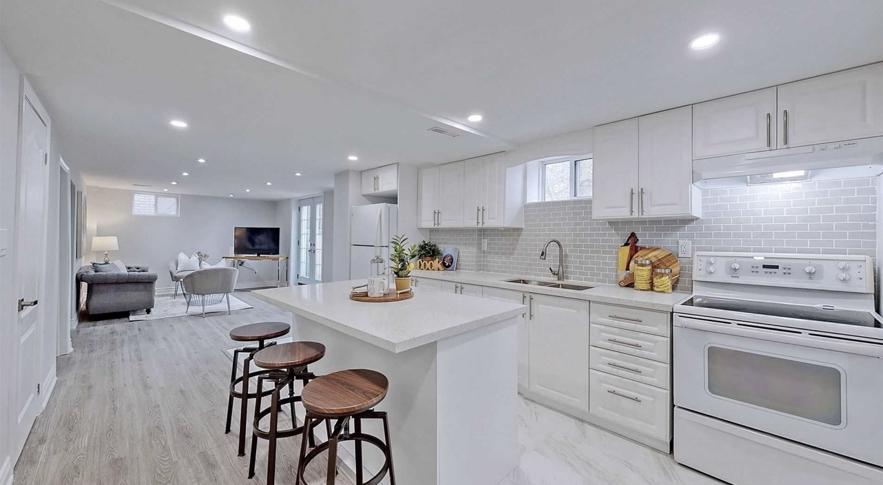 Staging an all white kitchen condo for a sale with white and wood furnitures by StyleBite Staging services in Toronto. 